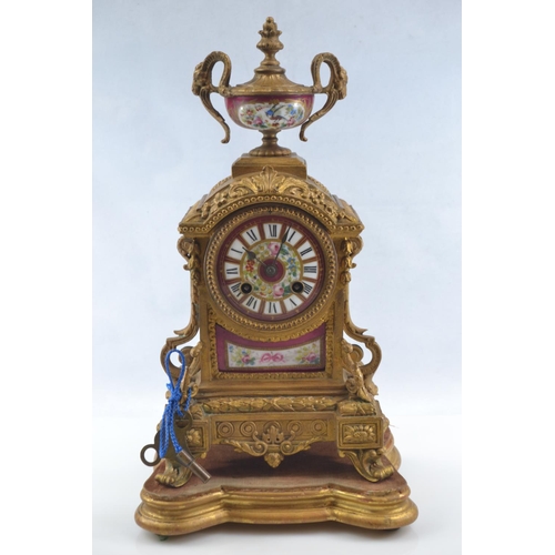 441 - Gilt metal and hand painted porcelain three piece mantle clock garniture, late C19th/early C20th, th... 