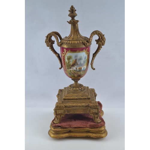 441 - Gilt metal and hand painted porcelain three piece mantle clock garniture, late C19th/early C20th, th... 