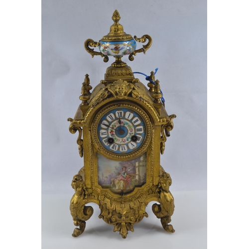 442 - Gilt metal and hand painted porcelain three piece mantle clock garniture, late C19th/early C20th, de... 