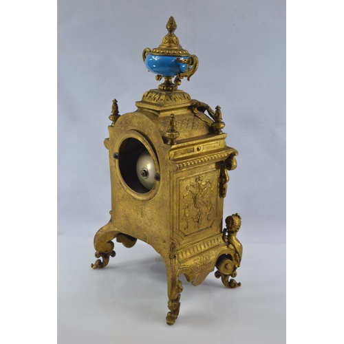 442 - Gilt metal and hand painted porcelain three piece mantle clock garniture, late C19th/early C20th, de... 