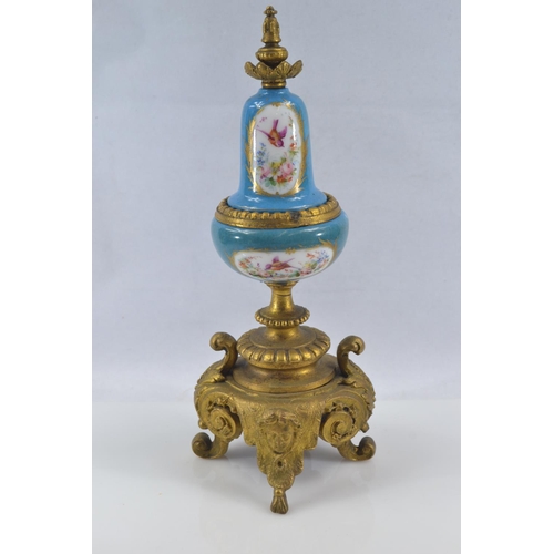 442 - Gilt metal and hand painted porcelain three piece mantle clock garniture, late C19th/early C20th, de... 