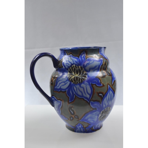 450 - Carltonware handcraft, blue abstract floral jug. Height 20.5cm.