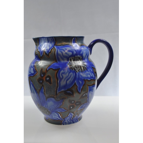 450 - Carltonware handcraft, blue abstract floral jug. Height 20.5cm.