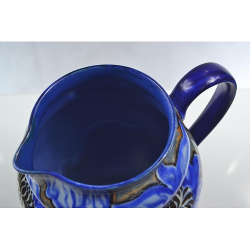 450 - Carltonware handcraft, blue abstract floral jug. Height 20.5cm.