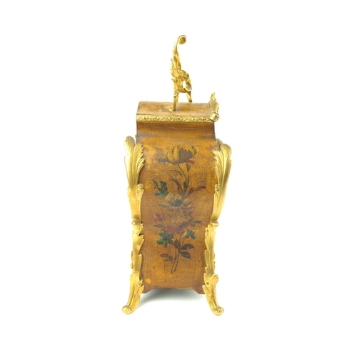 458 - A Vernis Martin style mantle clock, painted with a figure in a landscape and floral sprays, foliate ... 