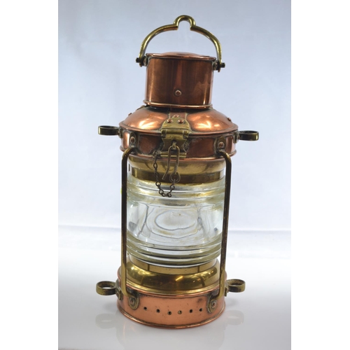 460 - Brass and copper ships anchor oil lamp with thick glass lens H32cm