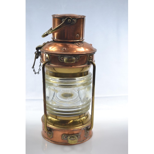 460 - Brass and copper ships anchor oil lamp with thick glass lens H32cm