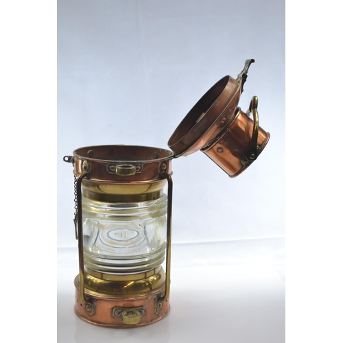 460 - Brass and copper ships anchor oil lamp with thick glass lens H32cm