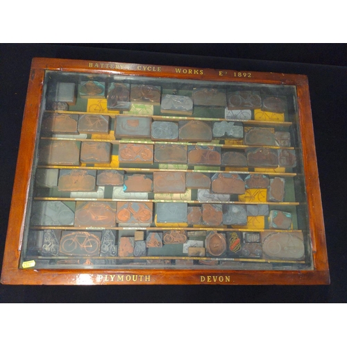 494 - Battery Cycle Works Est. 1892 Plymouth Devon, glass topped display case with 75 bicycle printing blo... 