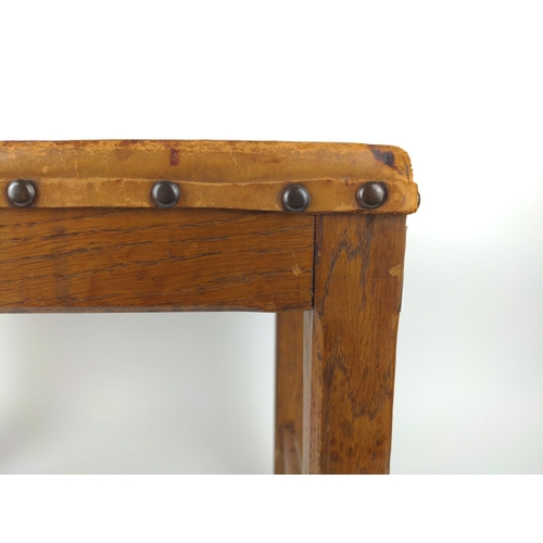 496 - Embossed leather topped stool in oak, in southern European style.