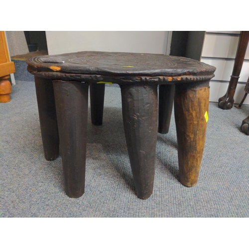 497 - Nine legged Nigerian Nupe stool. W40 D36 H25.5 cm