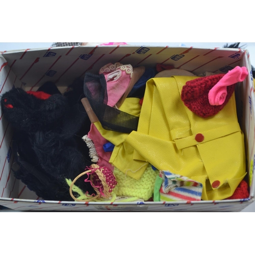 506 - Five boxed Sindy Pedigree furniture sets together with a large quantity of vintage doll clothes (mos... 