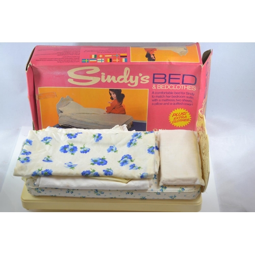 506 - Five boxed Sindy Pedigree furniture sets together with a large quantity of vintage doll clothes (mos... 