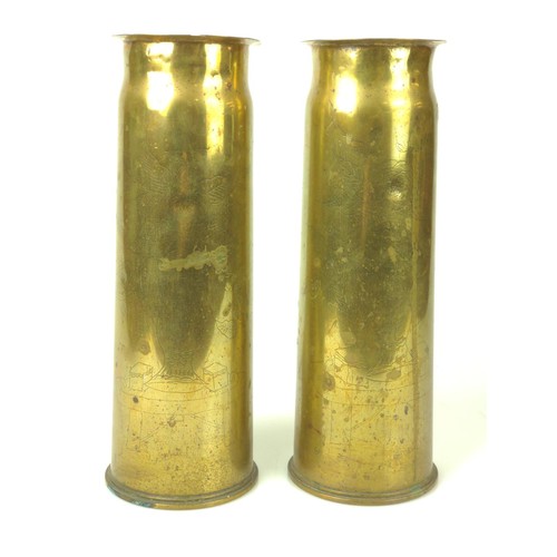 352 - Pair of 1918 Trench art shell cases with fine etched oriental detail. H29cm (Base D10cm)