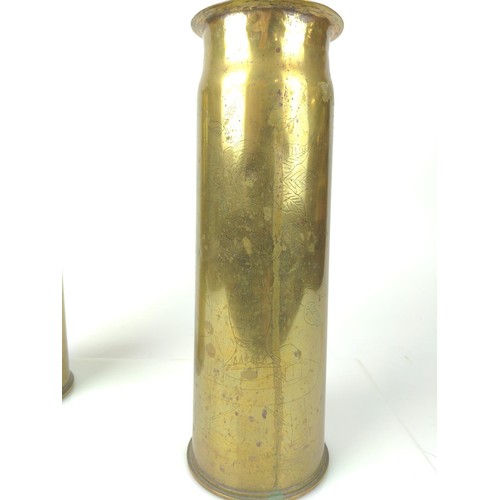 352 - Pair of 1918 Trench art shell cases with fine etched oriental detail. H29cm (Base D10cm)