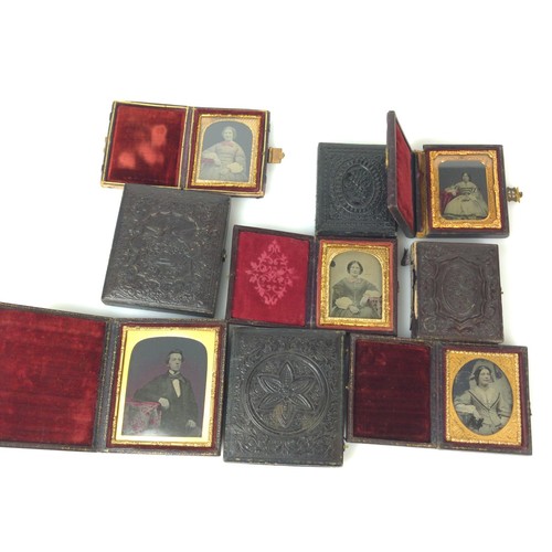 429 - Nine daguerreotype portraits in decorative folding frames.