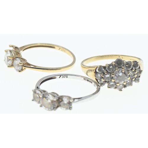 107 - Three 9ct gold rings set with CZ, sizes K-M, gross weight 5.21 grams, one stone missing