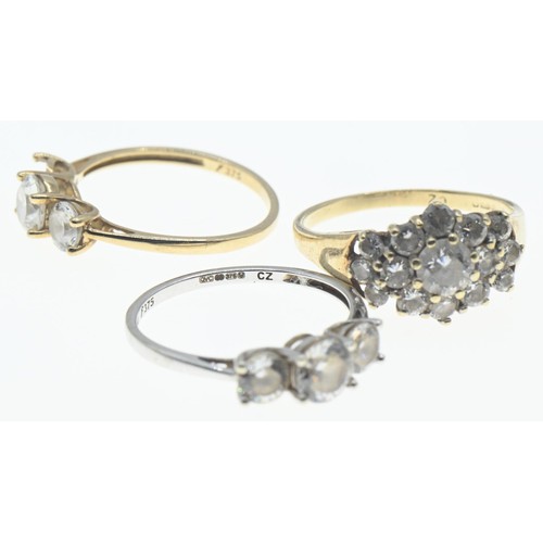 107 - Three 9ct gold rings set with CZ, sizes K-M, gross weight 5.21 grams, one stone missing