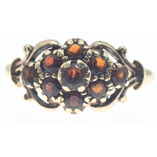 112 - Yellow metal and garnet cluster ring, tests positive for 9ct gold, size R, gross weight 3.74 grams