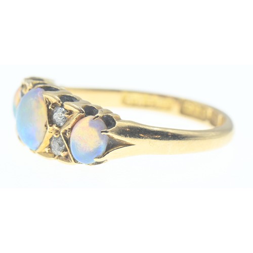 111 - 18ct gold, opal and diamond ring. Size N, gross weight 3.4g