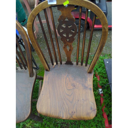 380 - Two elm wheel back kitchen chairs. 