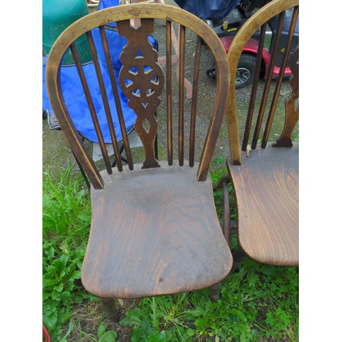 380 - Two elm wheel back kitchen chairs. 