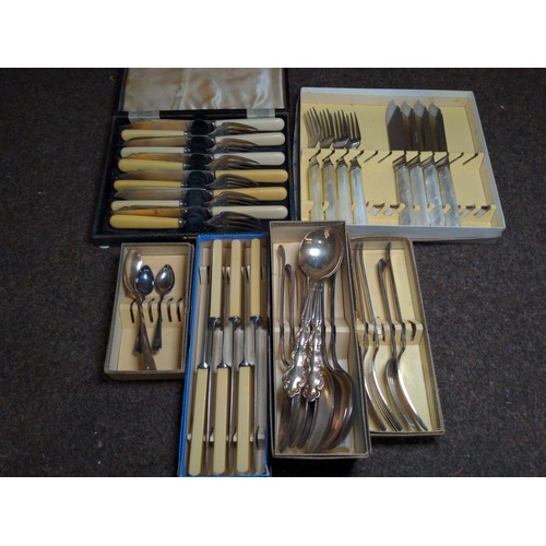 695 - Six boxed mixed plate ware, knives, forks, spoons etc..,