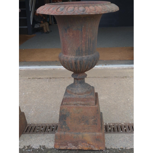 295B - A pair of impressive fluted cast iron garden urns. Dia 49 cm Height 89 cm. Flowers not included.