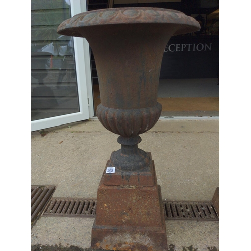 295B - A pair of impressive fluted cast iron garden urns. Dia 49 cm Height 89 cm. Flowers not included.