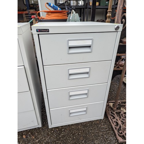 312A - Two metal filing cabinets by Triumph both 4 drawers. 40 X 40 X 64 CM