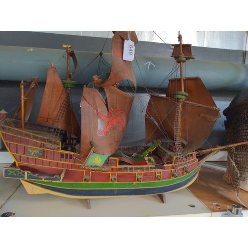 468 - Model galleon with four masts and sails in period style with twelve canon on a stand.