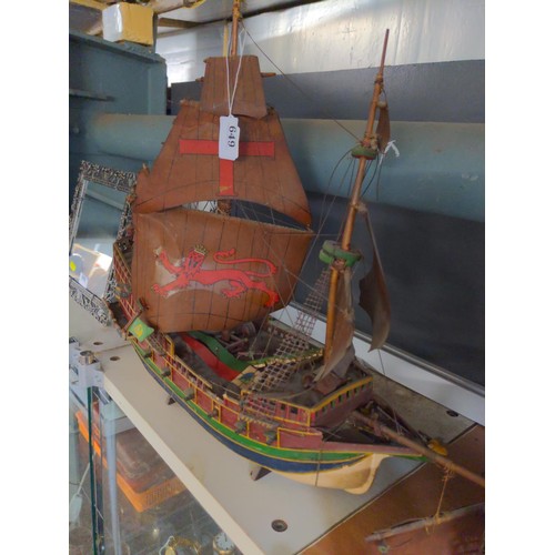 468 - Model galleon with four masts and sails in period style with twelve canon on a stand.