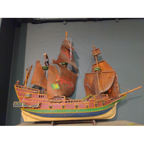 468 - Model galleon with four masts and sails in period style with twelve canon on a stand.