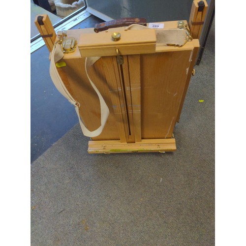 289 - Portable artists box with standing legs and easel .