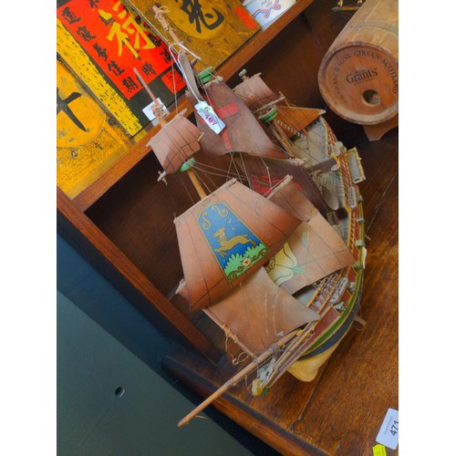 468 - Model galleon with four masts and sails in period style with twelve canon on a stand.