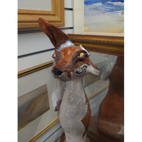 487 - 2x Jennie Hale ceramic foxes. H75cm. Areas of damage and repair, including lost ear (but included)