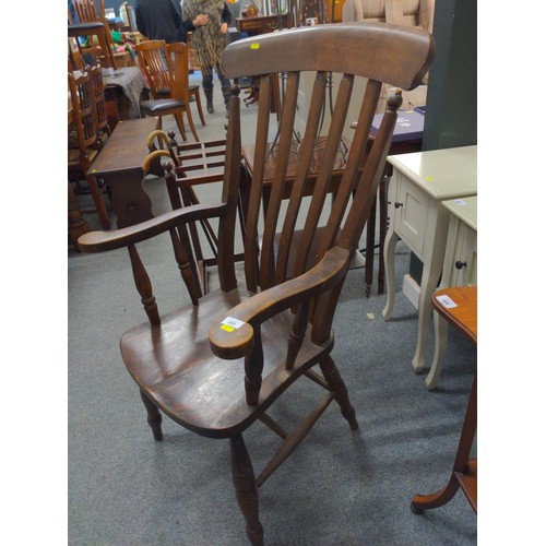 489 - Elm seated carver chair. In need of repair