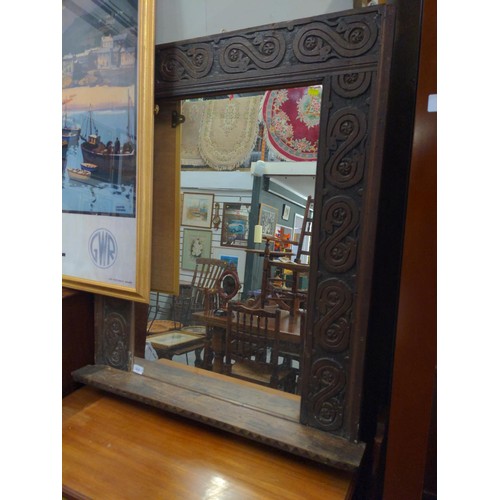 510 - Mirror framed with and early oak frieze. 89cm x 103cm with lower shelf