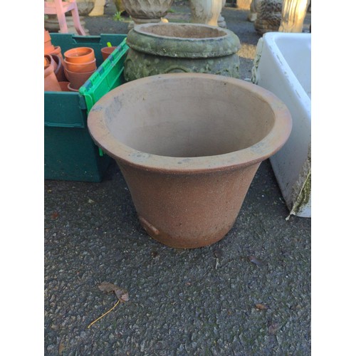 86 - Three terracotta graduated pots plus one stone planter. D42cm x H31cm