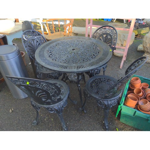 88 - Alloy garden table and four chairs painted black. Table D81cm x H71cm