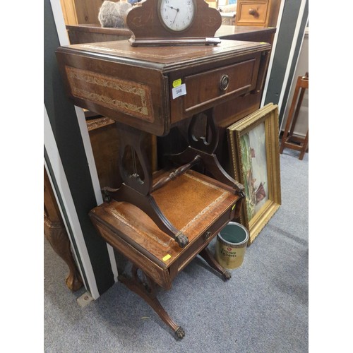 566 - Pair of double drop end leather topped side tables with single drawers on casters.