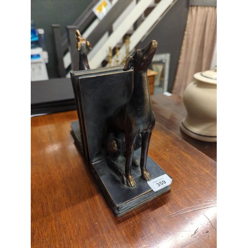 359 - Resin bookends in the form of bronzed greyhounds sitting on books, height 23cm. One bookend with sma... 