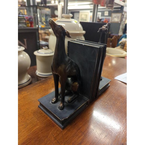 359 - Resin bookends in the form of bronzed greyhounds sitting on books, height 23cm. One bookend with sma... 