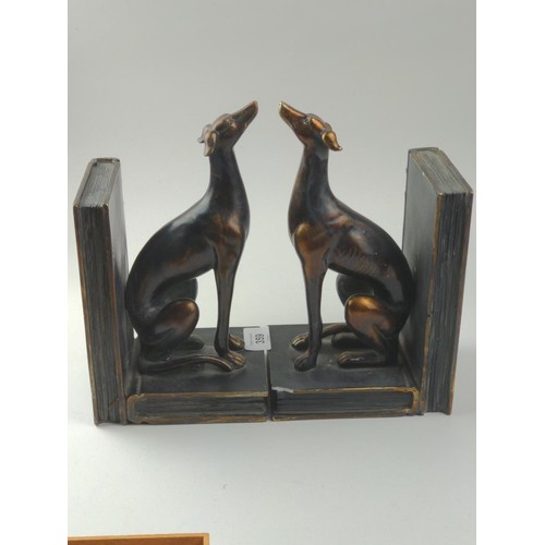 359 - Resin bookends in the form of bronzed greyhounds sitting on books, height 23cm. One bookend with sma... 