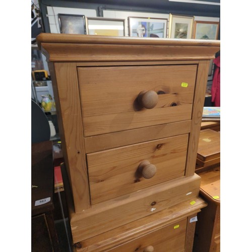 581 - Pine bedside cabinet with two drawers. w55 d39 h61 cm