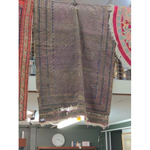 884 - Worn eastern rug in faded purple