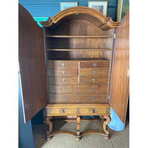 890 - Large Burr Walnut 10 drawer and two shelves Armoire on turned legs and bun feet. W100 D46 H191