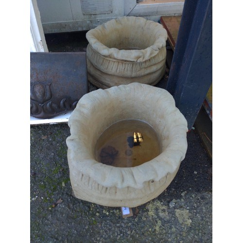 139 - Pair of concrete sack shaped planters. D45cm x H25cm