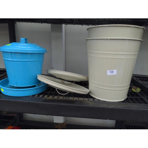 130 - Two enamel buckets/bins with lids and blue enamel feeder.