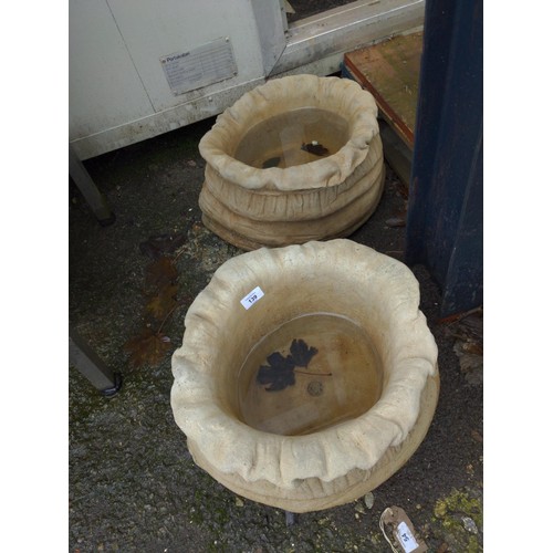 139 - Pair of concrete sack shaped planters. D45cm x H25cm